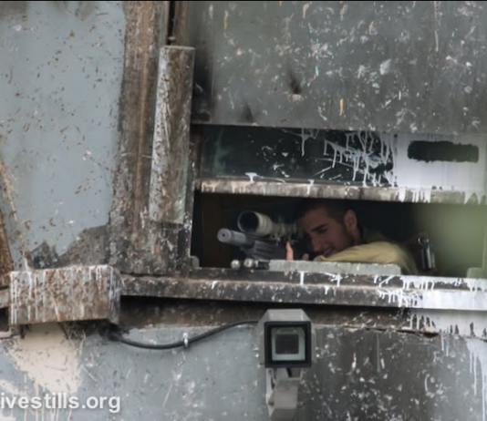 Israeli sniper position in a watchtower in the illegally occupied West Bank