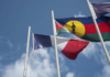 The French and Kanak flags flying high