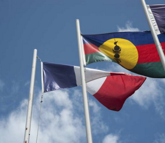 The French and Kanak flags flying high