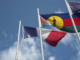 The French and Kanak flags flying high