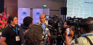 Local Fiji journalists conduct an interview at the Pacific Peace and Security Dialogue in Suva