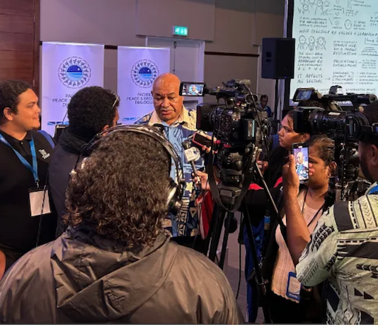 Local Fiji journalists conduct an interview at the Pacific Peace and Security Dialogue in Suva