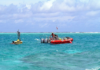 Oceanographers deploy a buoy inside the Rose Atoll in American Samoa waters